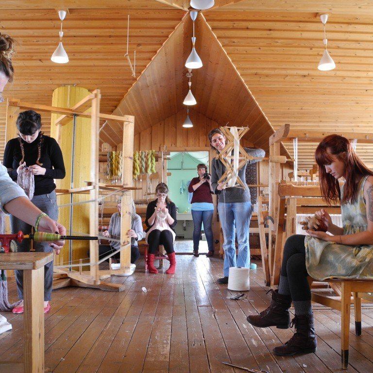 Group of artists staying in the summer of 2015 working in the Textile Center loom studio. Picture: Textile Center.