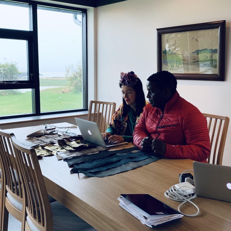 Elisa Palomino and Edwin Phiri working in the living / dining room in House Árbraut 33. Picture: Textile Center.