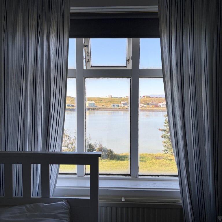 Bedroom on the residency floor with a riverside view.