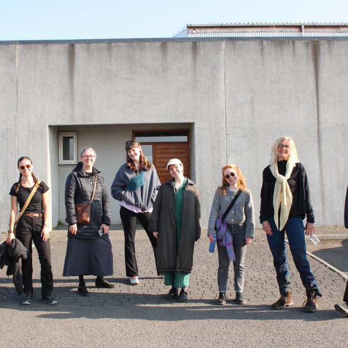Seven out of 13 artists in residence in April 2025 in front of the Ístex Wool Washery in Blönduós.