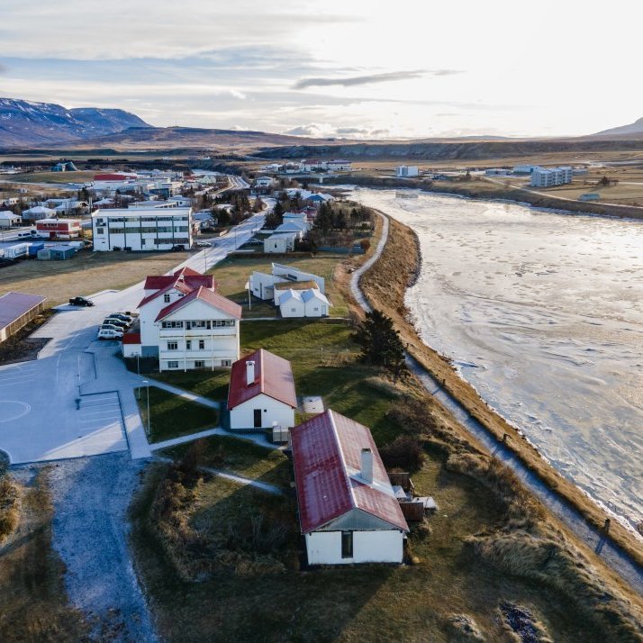 The TextileLab is located in the white 4-storey building down the road from Kvennaskólinn (the red-roofed building(s)).