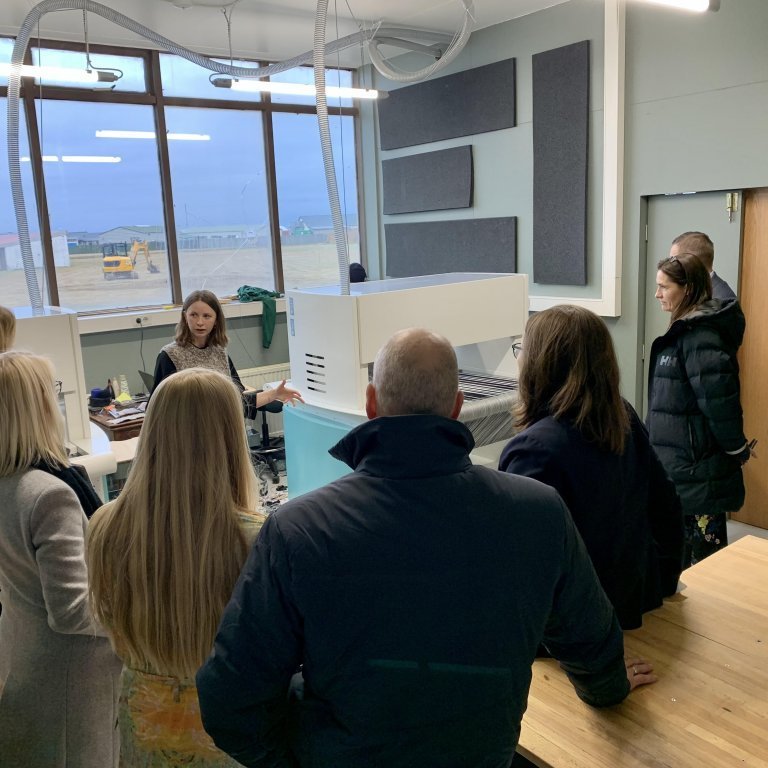Margrét Katrín Guttormsdóttir (center) introducing participants of the Association of Municipalities in Northwest Iceland (SSNV) annual meeting to the TextileLab in October 2021. Picture: Textile Center